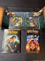 Open DVD gatefold showing two discs and outer DVD and VHS front covers