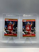 Front view of both Joe Montana cards in Card Shield holders