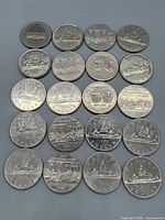 20 Canadian dollar coins reverse side showing mix of Voyageur and commemorative designs