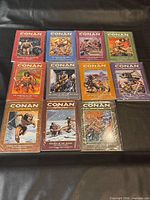 Front covers of all 11 Conan TPBs