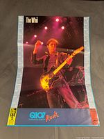 Front view of full poster showing image, calendar border, logos
