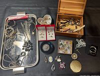 Overview of entire lot displayed on tray and beside watch box