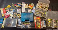 Overall view of lot with tackle boxes, packaged line, lures and accessories