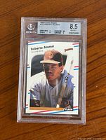 Front view of encapsulated Roberto Alomar rookie card showing grade label and card design