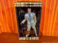 Front view of boxed Elvis Presley Collector Edition doll showing full figure and packaging