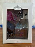 Front of original Hallmark Keepsake "Step Out in Style" Barbie ornament set box showing all seven miniature ornaments