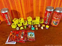 Full lot with both Rotten Soda cans, yellow crates, figures and cards