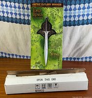 Front of retail box atop shipping carton