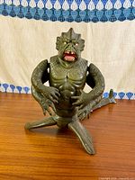 Full body view of Kraken figure standing on table