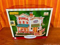 Front of sealed box showing Tony's Pizza Shack image and Lemax logo