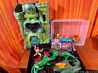 Overall lot with Castle Grayskull front shell, figures, Battle Cats, minicomics, accessory bin