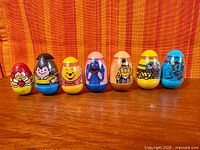 All seven Weebles figures lined up
