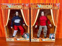 Front of both boxed marionette dolls