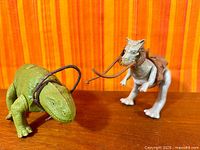Dewback and Tauntaun side by side with reins and saddles visible