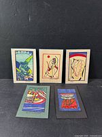 Group shot of five abstract marker drawings on backing cards