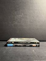 Front angle of both video cases showing spines
