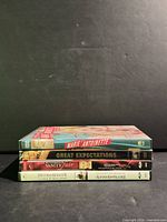 Stack of all four DVD cases side profile