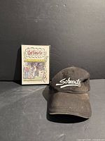 Hat and sealed DVD side by side