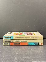 Spine view of three Granta paperbacks stacked: Best of Young American Novelists 2, Hidden Histories, New World.