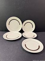 Group of six plates showing two sizes