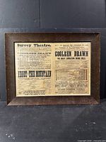 Front view of framed broadsheet showing full text and frame