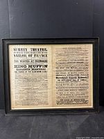 Full view of framed broadsheet in black frame