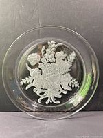 Front view showing entire plate and etched floral bouquet