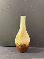 Front view of handmade ceramic vase showing color gradient and drip pattern