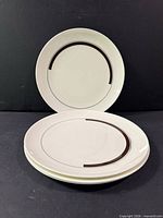 Stacked and standing view of four Wedgwood Prelude plates