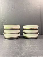 Stacked view of six Sango Quadrille Black Satin bowls showing color band and shape