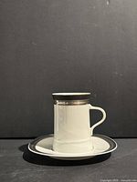 Cup on saucer showing pattern and condition