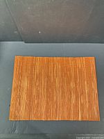 single placemat laid flat to show full size and weave pattern