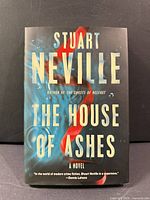 Front cover of "The House of Ashes" hardcover with dust jacket