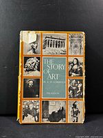 Front view of the book showing dust jacket design and wear