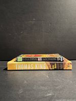 Two books stacked: Clay Dancers on top, Deep House below