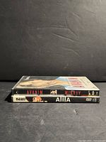 Two DVD cases stacked showing spines Avanim and Alila