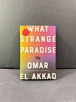 Front cover of hardcover novel showing title and author