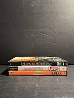 Three DVDs stacked side view showing titles