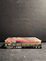 Spines of three DVDs showing titles