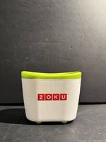 Front view of Zoku Quick Pop Maker showing logo and color scheme