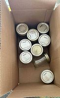 Open box showing multiple Bernardin jars with lids