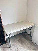 Lifetime folding table fully set up against wall