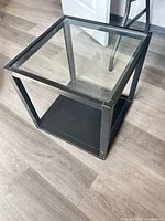 Perspective view showing glass top and metal frame