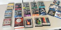 Overview of Star Trek DVD and Blu-ray boxed sets and movie cases laid out on table