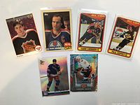 All six hockey cards laid out