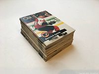 Stack of trading cards showing Derrick Smith card on top