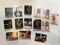 All 16 hockey trading cards laid out