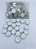 Bag and loose tea light candles displayed