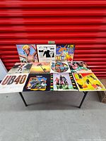 Tabletop view of 12 album covers