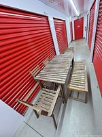 Full view of wooden patio dining set: table, bench, five chairs